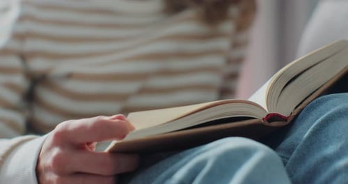 Woman Reading Hardcover Book Indoors