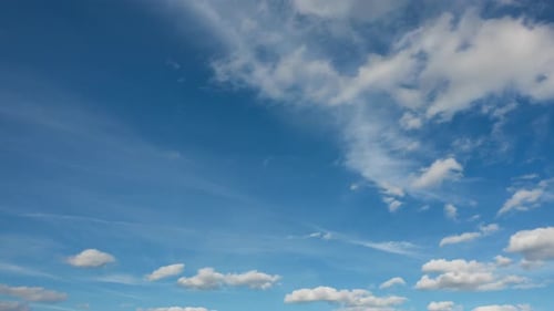 Clouds Moving Slowly Across a Blue Sky