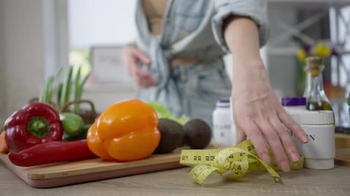 Vitamins and Fresh Vegetables in Bright Home Kitchen