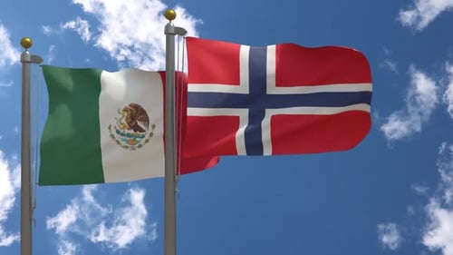 Mexico and Norway Flags Waving Under Blue Sky