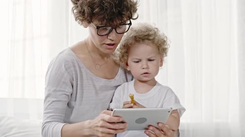 Mother and Child Enjoying Tablet Device Together