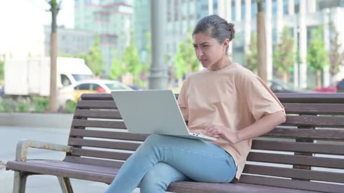 Indian Woman Having Back Pain While Using Laptop in Office