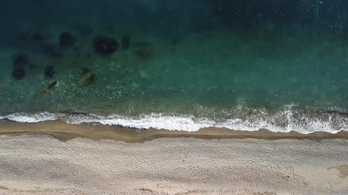 Aerial View From Above on Calm Azure Sea and Volcanic Rocky Shores