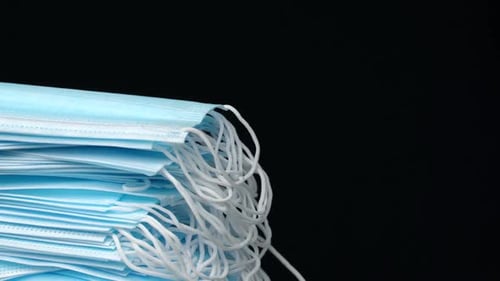 Stack of Blue Surgical Masks Close Up