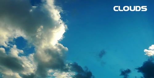 Clouds Moving across Bright Blue Sky