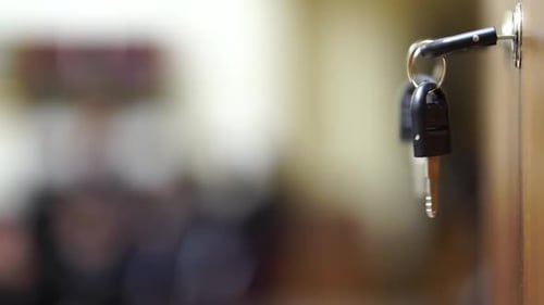 Key Hanging from the Door Lock Inside