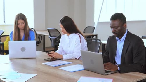 Diverse Team Working Together in Modern Office