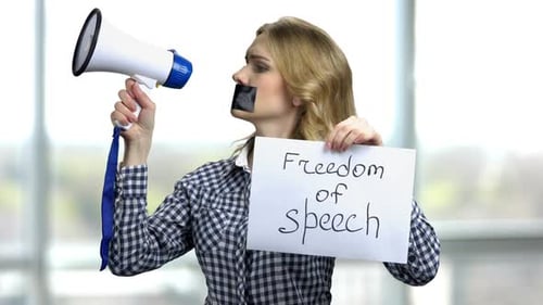 Woman Protesting with Megaphone and Freedom of Speech Sign