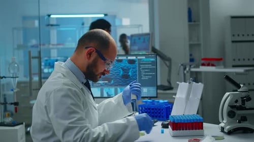 Scientist Pipetting Liquid in Modern Laboratory