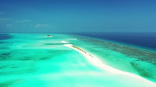 Aerial top down travel of relaxing island beach trip by blue green water with white sand background