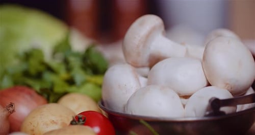 Fresh Food Ingredients On Wooden Table In Kitchen