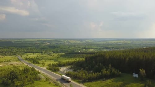 Truck Travels Rural Highway Aerial View
