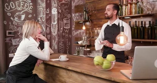 Restaurant Staff After a Work Day Relaxing and Socialising at the Bar