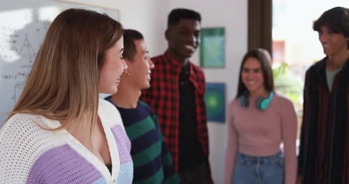 Diverse Students High Five in a Classroom