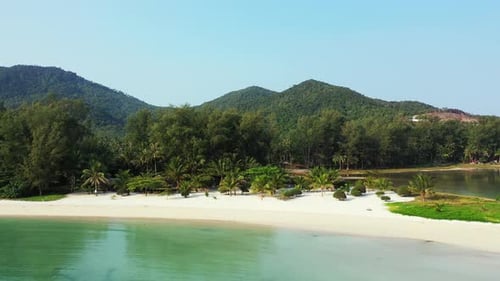 Tropical birds eye abstract shot of a white sandy paradise beach and turquoise sea background in col