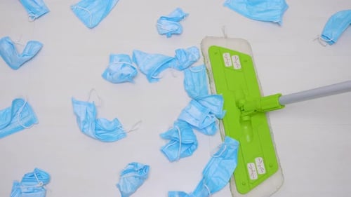 Many Used Medical Masks Wiped with a mop.The Floor Is Cleaned By a Mop From a Medical Protective