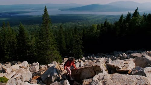 Young Woman Having an Adventure - Going on the Mountain with Backpack on Her Back