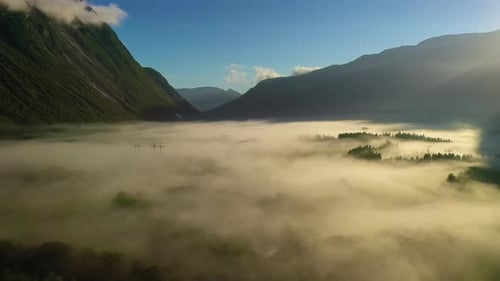 Morning Mist Over the Valley Among the Mountains in the Sunlight