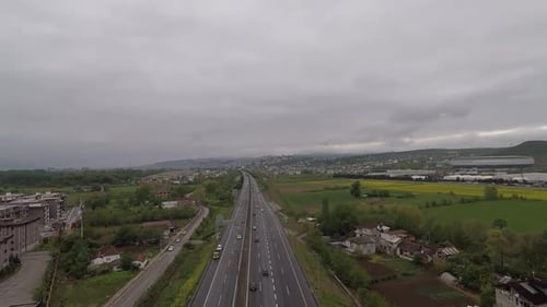 Aerial Highway and Cloudy Sky
