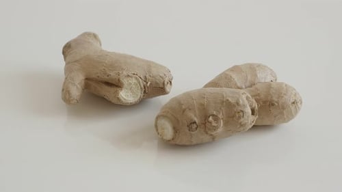 Ginger root on the table 4K 2160p 30fps UltraHD tilting footage - Zingiber officinale rhizome slo