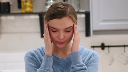 Woman with Headache Frustration and Tension at Home