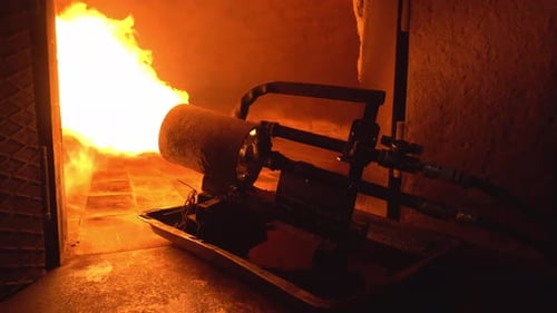 Production oven for making bread. Bakery. Large powerful fire cannon running