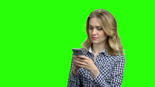 Blonde Woman Using Phone on Green Screen