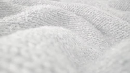 Extreme Detail View of Sheep Wool Cloth Texture Flowing in Macro Dolly Shot