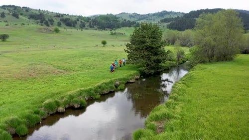 Trekking By The Creek In Aerial View 3