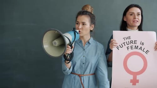 Slow Motion of Angry Feminists Protesters Screaming Holding Banners Fighting Against Sexism