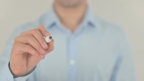 Person Writes Word World With Marker Close Up
