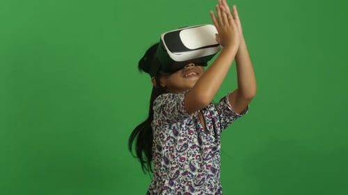 Girl Enjoys Playing with Virtual Reality Headset