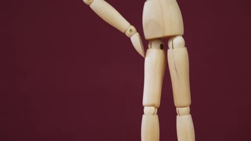 Wooden Mannequin Posing in a Thinking Position