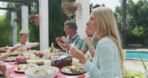 Family Meal Gathering Outdoors on Sunny Day