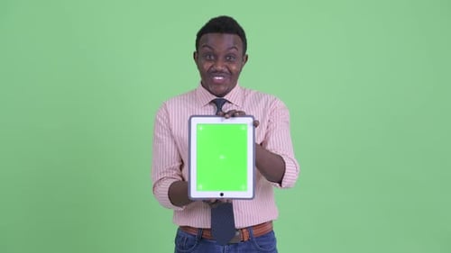 Man Holding Tablet with Chroma Key Screen