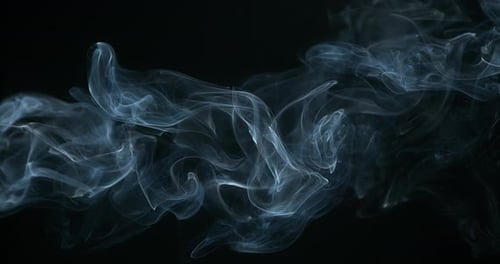 Delicate Blue Smoke Flowing on Black Background