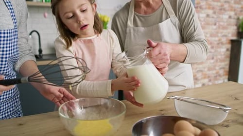 Family Baking Together in Cheerful Kitchen