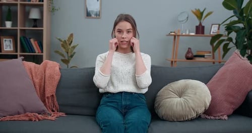 Woman Speaking Using Sign Language on Sofa