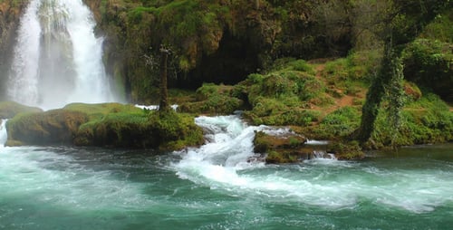 Picturesque Waterfall Flowing into River