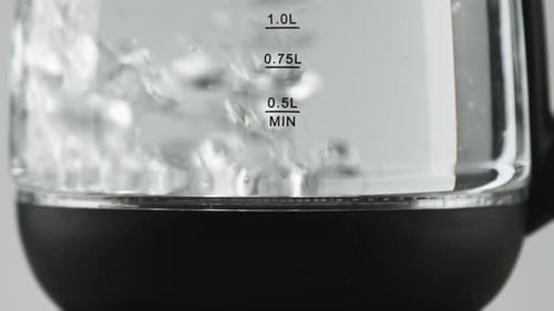 Water Boiling in Glass Electric Kettle, Close Up