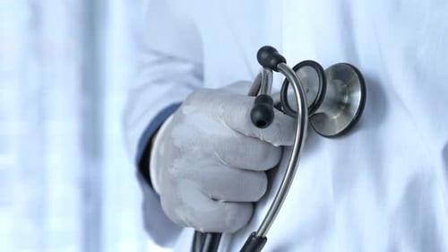 Close Up of Doctor with Arms Crossed and Stethoscope on Neck ,