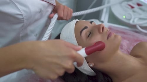 Woman Receiving Facial Treatment in Medical Spa