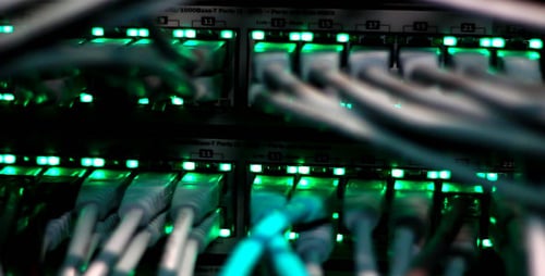 Cables Plugged Into Network Server With Green Lights