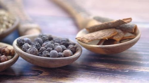 Spices and Herbs in Wooden Spoons, Close Up