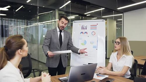 Presentation in Modern Office with Diverse Employees