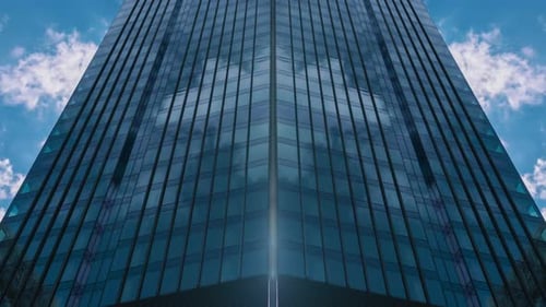Timelapse Modern Skyscraper Glass Surface High Office Building Blue Sky and Clouds Moving Fast