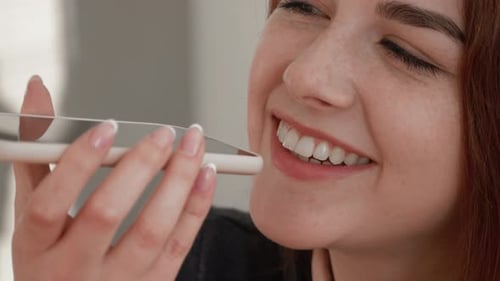 Young Woman Using Voice to Text Feature
