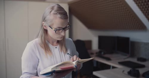 Woman Working in Office at Home