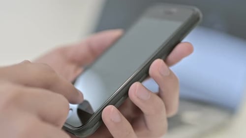 Close Up of Hands Using a Smartphone
