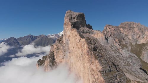 Aerial Shot of Flying Over the Mountain Peaks Among the Clouds